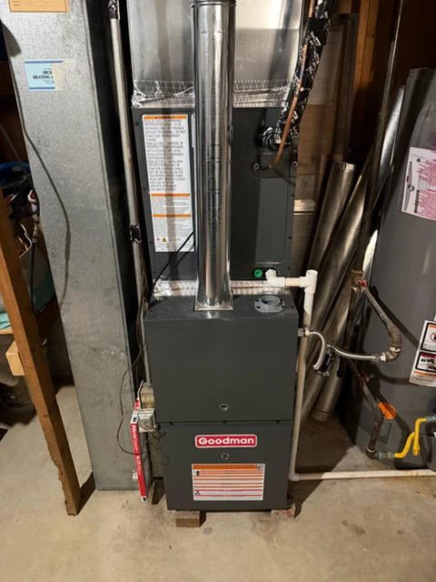 Goodman high-efficiency gas furnace installation with metal venting